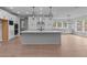 Spacious kitchen with a large center island and a stainless steel range hood at 4830 Briscoe Dr, Cumming, GA 30028