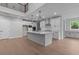 Modern kitchen with island, stainless steel appliances, and plenty of cabinet space at 4830 Briscoe Dr, Cumming, GA 30028