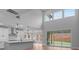 Bright living area with ample natural light from large windows and open floor plan with a view of the backyard at 4830 Briscoe Dr, Cumming, GA 30028
