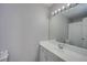 Bathroom featuring white vanity with sink, mirror, and lighting fixture at 5381 Briar Creek Ln, Norcross, GA 30071