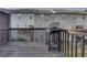A wooden deck features the gas grill with railing and townhouse view at 5381 Briar Creek Ln, Norcross, GA 30071