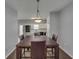 Dining room with a view into the kitchen and featuring modern lighting at 5381 Briar Creek Ln, Norcross, GA 30071