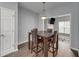 Dining area with contemporary lighting fixture and a view of the living room at 5381 Briar Creek Ln, Norcross, GA 30071