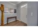 Inviting foyer with wood floors, staircase, console table, and white front door at 5381 Briar Creek Ln, Norcross, GA 30071