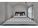 Serene main bedroom offering a comfortable bed, soft lighting, and calming color scheme at 5381 Briar Creek Ln, Norcross, GA 30071