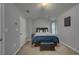 Cozy main bedroom with plush carpet, a comfortable bed, and neutral decor at 5381 Briar Creek Ln, Norcross, GA 30071