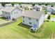 Aerial view of a home and its expansive green lawn from above showcasing neighborhood at 7814 Messina Ct, Lithia Springs, GA 30122