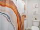 Bright bathroom featuring a stylish shower curtain, fresh white walls, and tasteful botanical wall decor at 7814 Messina Ct, Lithia Springs, GA 30122