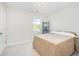 Cozy bedroom with neutral tones, featuring a comfortable bed and natural light at 7814 Messina Ct, Lithia Springs, GA 30122
