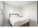 Neutral bedroom with a gray wood frame bed, soft carpet, and natural light through the window at 7814 Messina Ct, Lithia Springs, GA 30122