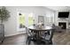 Cozy dining room with hardwood floors, a fireplace, and sliding doors to a yard view at 7814 Messina Ct, Lithia Springs, GA 30122
