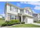 Charming two-story home featuring a brick and siding exterior, with a manicured lawn at 7814 Messina Ct, Lithia Springs, GA 30122