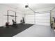Garage with gym equipment and ample space, ready for fitness or storage solutions at 7814 Messina Ct, Lithia Springs, GA 30122