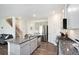 Beautiful kitchen boasts stainless appliances, stone counters, and an island with a dual sink at 7814 Messina Ct, Lithia Springs, GA 30122