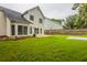 Spacious backyard featuring a patio, lush lawn, and privacy fence perfect for outdoor entertaining at 98 Coopers Glen Sw Dr, Mableton, GA 30126