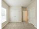 Bright bedroom featuring plush carpeting, ample closet space and natural light from a large window at 98 Coopers Glen Sw Dr, Mableton, GA 30126