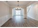 Dining room featuring new floors, modern lighting, and arched doorway at 98 Coopers Glen Sw Dr, Mableton, GA 30126