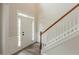 Bright entryway featuring new floors and staircase with white railings at 98 Coopers Glen Sw Dr, Mableton, GA 30126