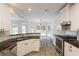 Open concept kitchen featuring modern appliances and a breakfast nook at 98 Coopers Glen Sw Dr, Mableton, GA 30126