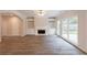 Spacious living room featuring a cozy fireplace and large windows at 98 Coopers Glen Sw Dr, Mableton, GA 30126