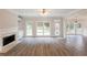 Bright living room with fireplace, built-ins, and new flooring at 98 Coopers Glen Sw Dr, Mableton, GA 30126