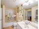 Well-lit bathroom featuring a shower-tub combination and ample vanity space at 230 E Ponce De Leon Ave # 324, Decatur, GA 30030