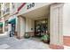 Inviting building entrance with planters and brick accents, showcasing the stylish facade at 230 E Ponce De Leon Ave # 324, Decatur, GA 30030