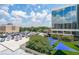 Exterior view features parking and blue canopies at 230 E Ponce De Leon Ave # 324, Decatur, GA 30030