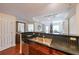 Open kitchen area with stainless steel sink, dishwasher, and dark wood cabinets at 230 E Ponce De Leon Ave # 324, Decatur, GA 30030