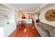 Bright living room featuring hardwood floors, built-in shelving, and a cozy dining area at 230 E Ponce De Leon Ave # 324, Decatur, GA 30030