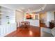 Comfortable living room with hardwood floors, built-in shelving, and an open kitchen concept at 230 E Ponce De Leon Ave # 324, Decatur, GA 30030