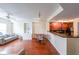 Spacious living room with hardwood floors, built-in shelving, and modern appliances at 230 E Ponce De Leon Ave # 324, Decatur, GA 30030