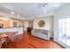 Inviting living room with access to balcony, featuring hardwood floors and modern fixtures at 230 E Ponce De Leon Ave # 324, Decatur, GA 30030