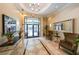 Elegant building lobby featuring tiled floors, seating, and a modern chandelier at 230 E Ponce De Leon Ave # 324, Decatur, GA 30030