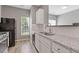 Well-lit kitchen featuring granite countertops, modern appliances, and hardwood flooring at 2566 Walden Lake Dr, Decatur, GA 30035