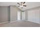 A spacious main bedroom features a ceiling fan, neutral walls, grey carpet, and a vaulted ceiling at 2566 Walden Lake Dr, Decatur, GA 30035