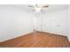 Bedroom featuring wood floors, ceiling fan, and ample storage with white closets at 30 Dunwoody Springs Dr, Atlanta, GA 30328