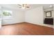 Bright, airy bedroom with wood floors and a view to an attached bathroom with a vanity at 30 Dunwoody Springs Dr, Atlanta, GA 30328