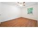 Bright bedroom with wood floors, ceiling fan, and a window providing natural light at 30 Dunwoody Springs Dr, Atlanta, GA 30328