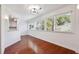 Bright dining area with hardwood floors, natural light, and a pass-through to a modern kitchen at 30 Dunwoody Springs Dr, Atlanta, GA 30328