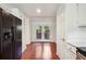 Kitchen with stainless steel fridge, granite counters and access to patio at 30 Dunwoody Springs Dr, Atlanta, GA 30328