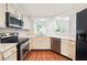 Modern kitchen with stainless steel appliances, white countertops, and plenty of cabinet space at 30 Dunwoody Springs Dr, Atlanta, GA 30328