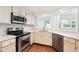 Stylish kitchen with stainless steel appliances and quartz countertops at 30 Dunwoody Springs Dr, Atlanta, GA 30328