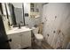 Cozy bathroom featuring decorative shower curtain and modern vanity at 3227 Due West Rd, Dallas, GA 30157