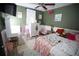 Bright bedroom with whimsical details, including a vanity, comfortable bed, and ample natural light at 3227 Due West Rd, Dallas, GA 30157