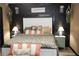 Close up of a charming bedroom with unique decor and a white headboard at 3227 Due West Rd, Dallas, GA 30157