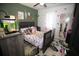 Colorful bedroom with butterfly rug and artwork, and decorative shelves at 3227 Due West Rd, Dallas, GA 30157