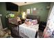 Cozy bedroom with playful decor, perfect for a , featuring a comfortable bed and ample storage at 3227 Due West Rd, Dallas, GA 30157