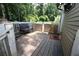 Outdoor deck with bench seating offers relaxing views of the yard and surrounding greenery at 3227 Due West Rd, Dallas, GA 30157