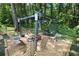 Cozy outdoor fire pit area with comfortable seating, stylish lighting, and grill area for entertaining at 3227 Due West Rd, Dallas, GA 30157
